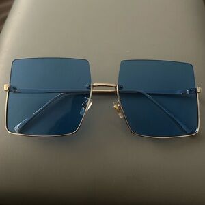 Rimless Blue Lens Sunglasses with Gold Frame